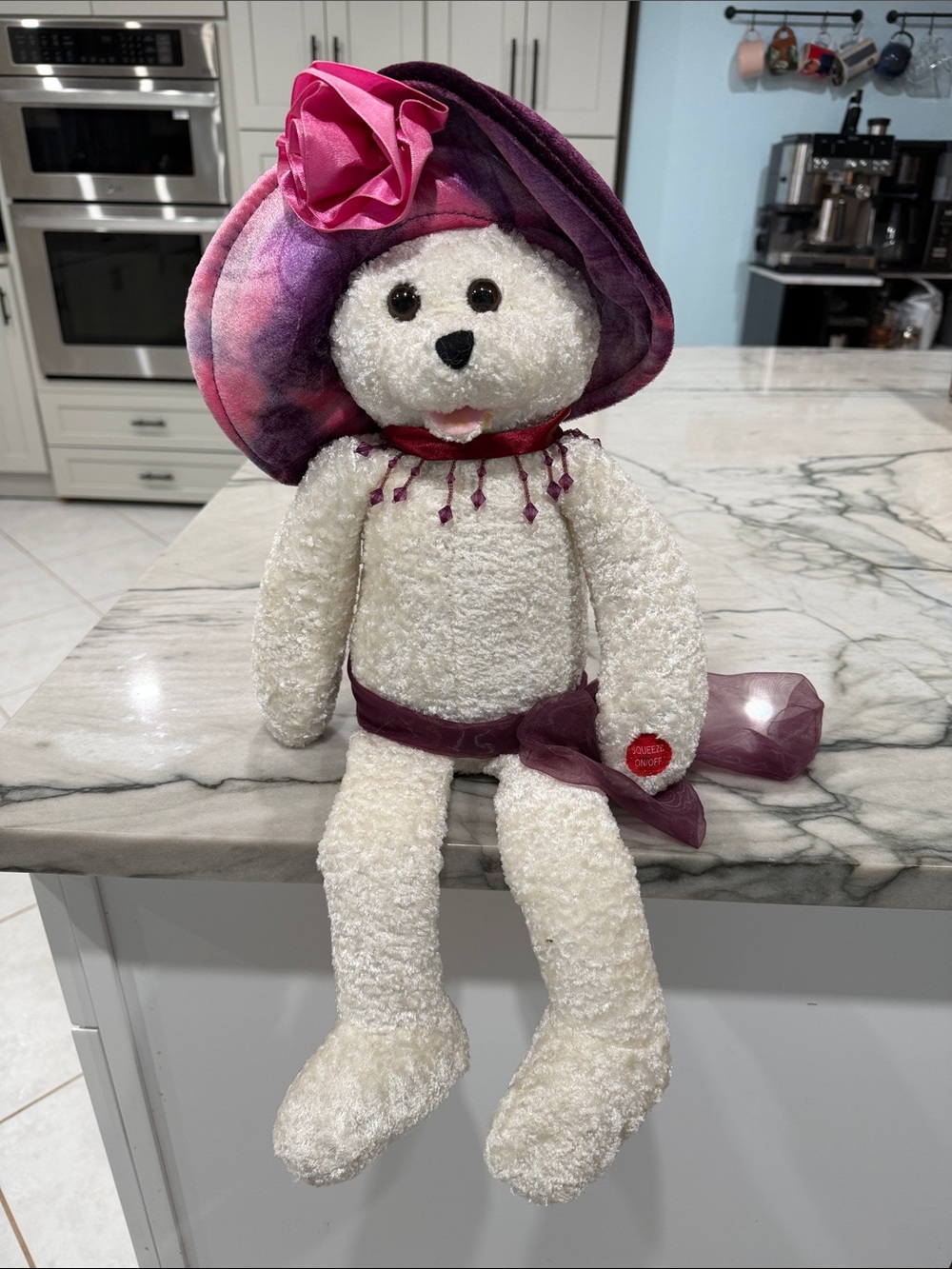 This is a 22-inch Collina singing and musical teddy bear made by Chantilly Lane
